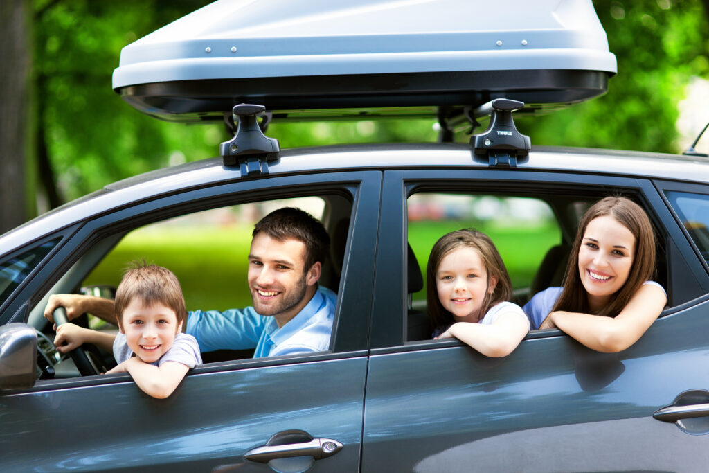 Happy Family on a trip in a Rental Car